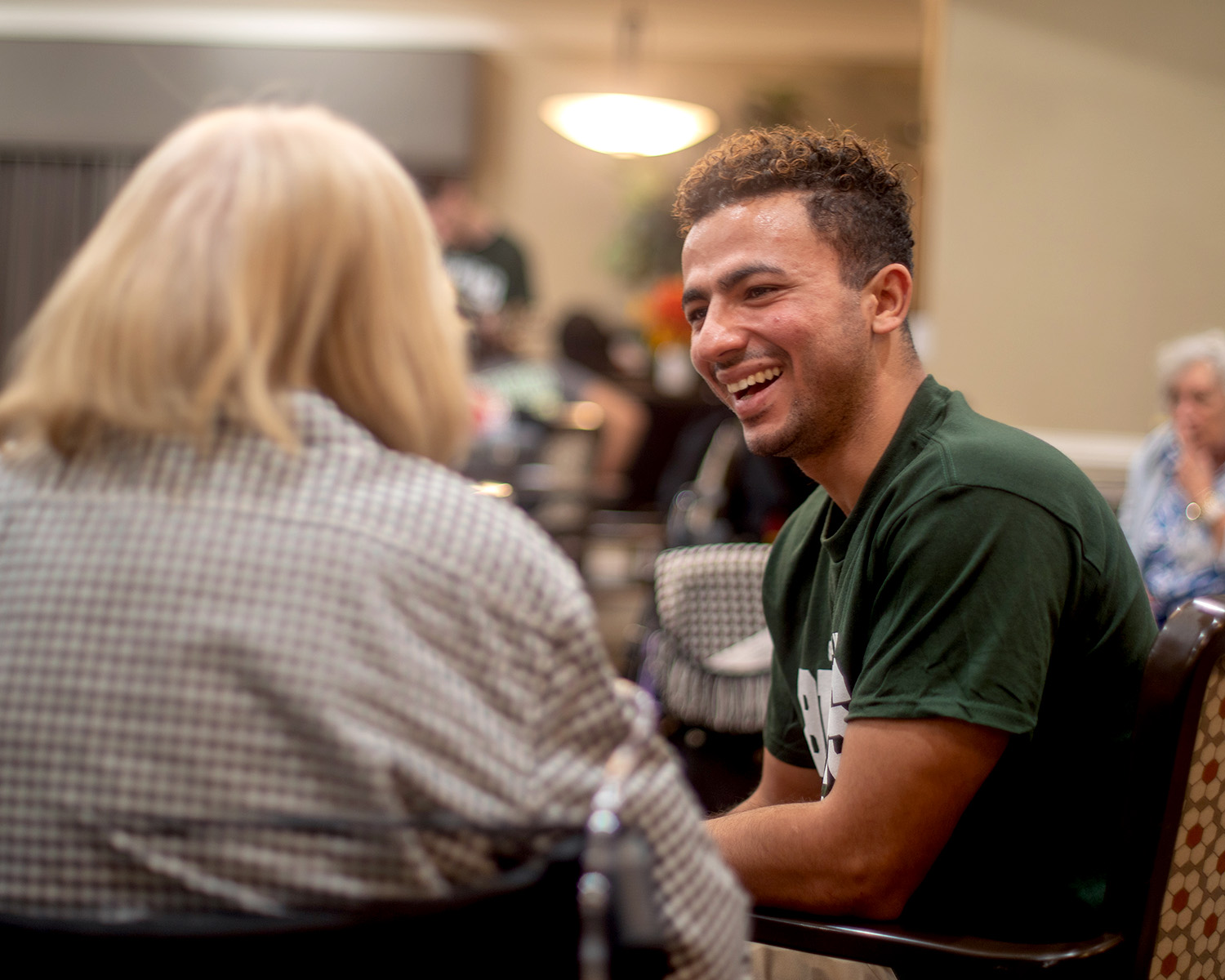 A Southern student speaks with a senior neighbor