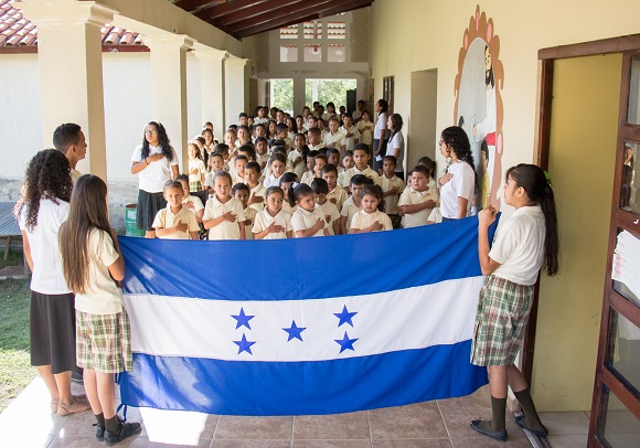 Pledging allegiance to the Honduran flag