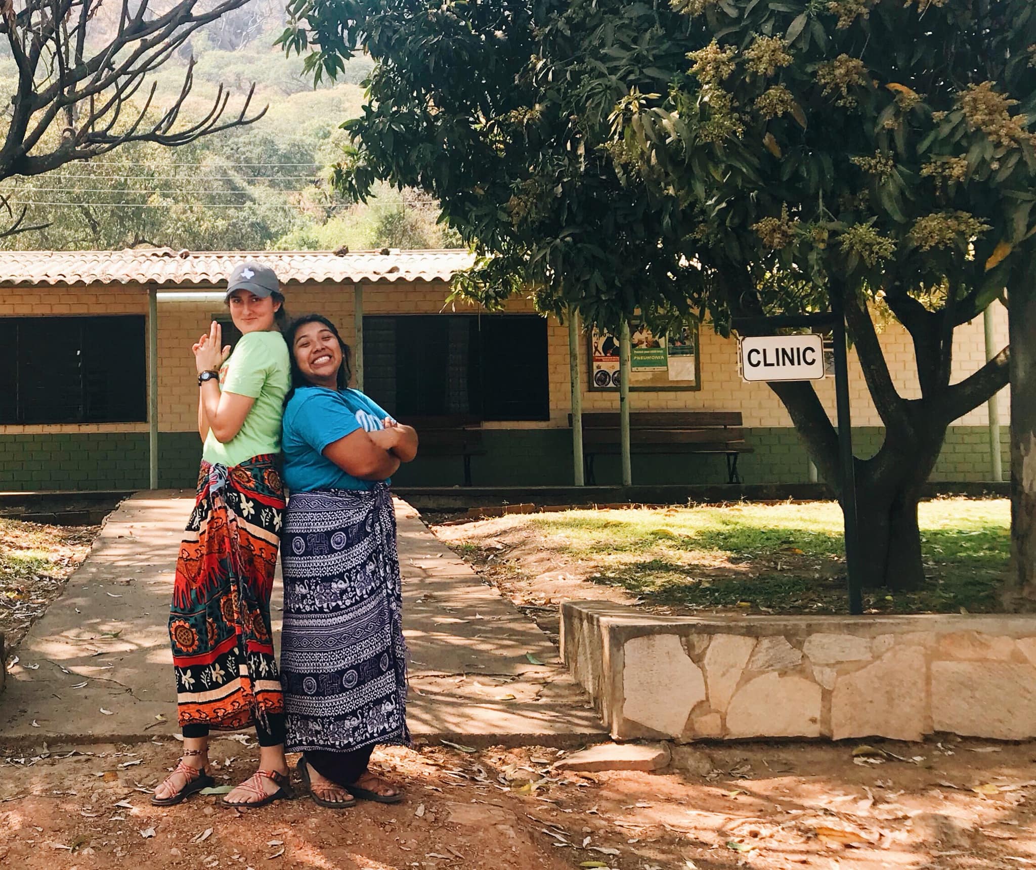 Carolina and Melanie ('18-'19) in front of the clinic