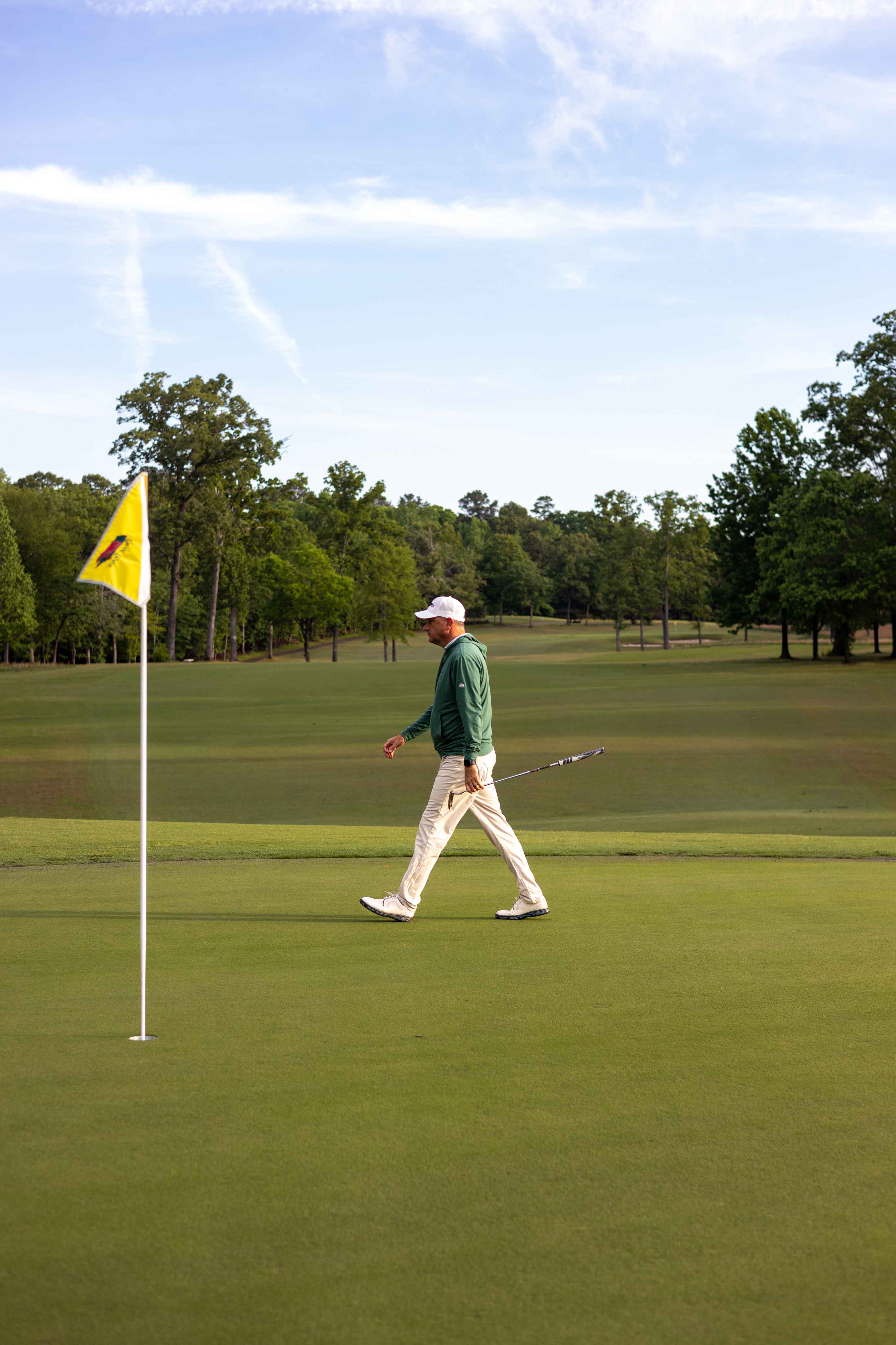 Golfer walking on the green