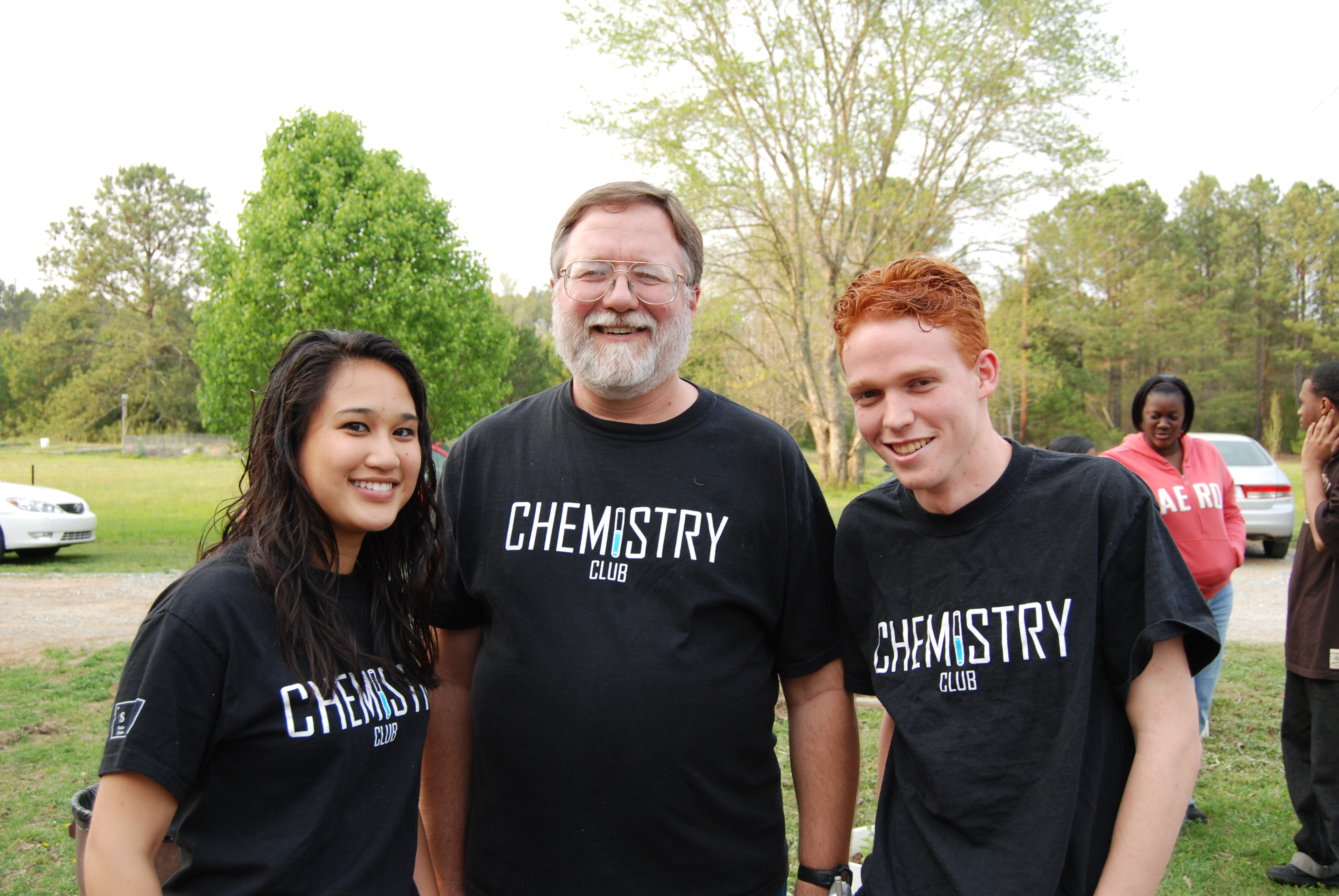 Three people smiling