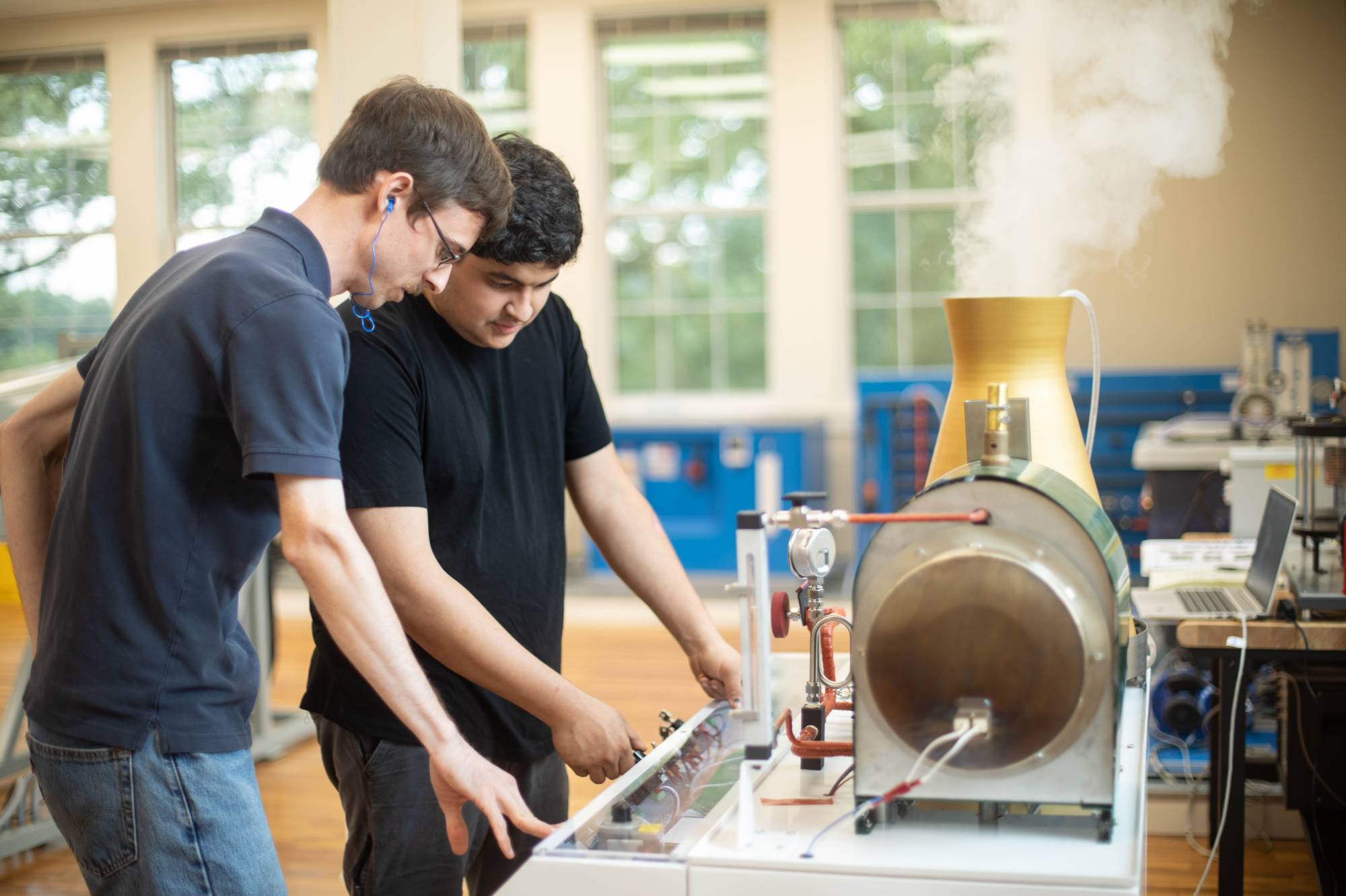 Southern Professor, Sean Walters, and an engineering student work on a project