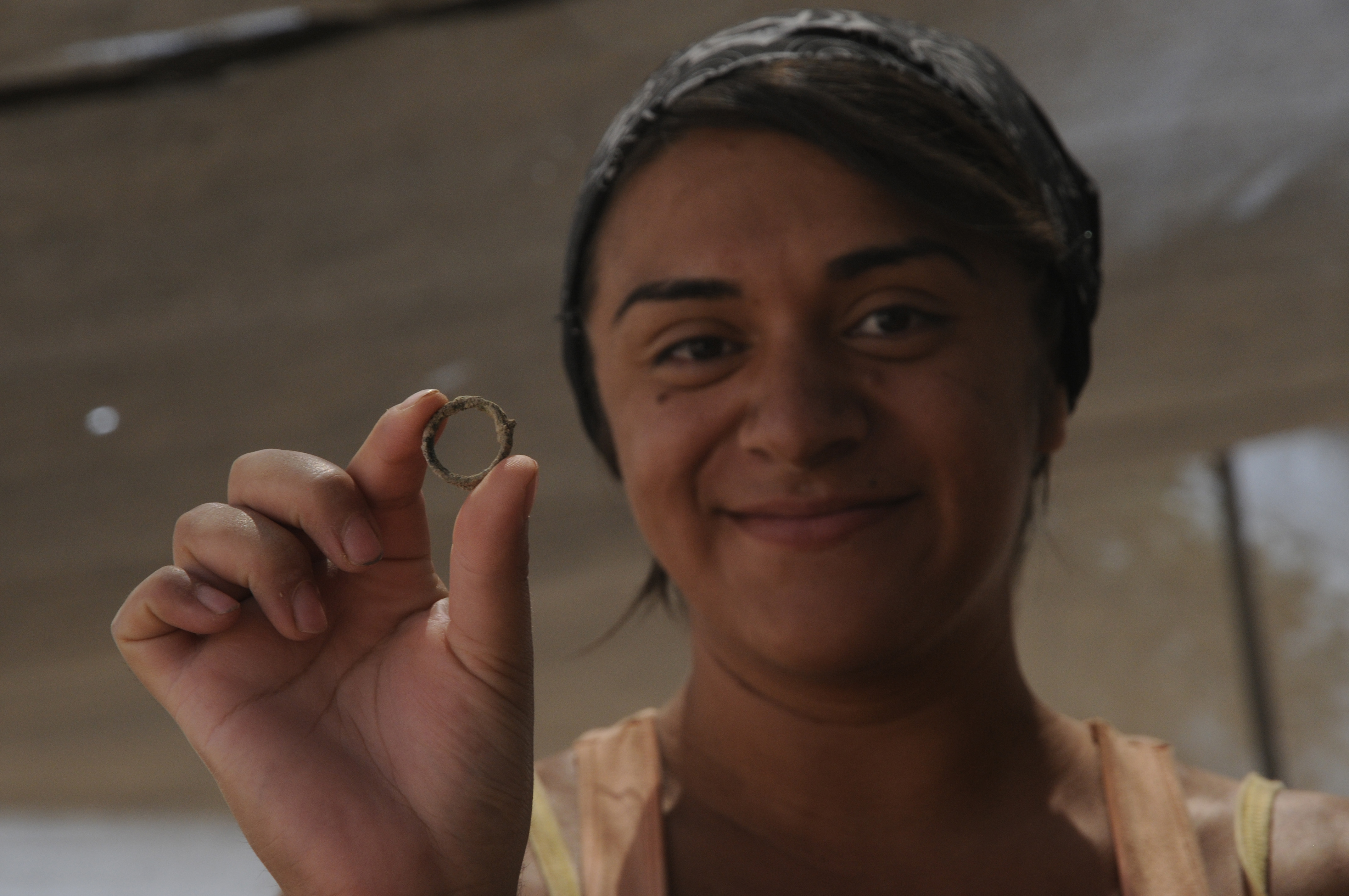 Volunteer holding a artifact