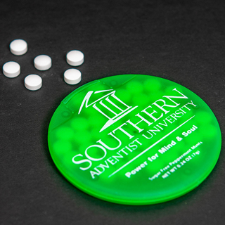 Round green plastic mint container with Southern's logo, tagline, and contact information