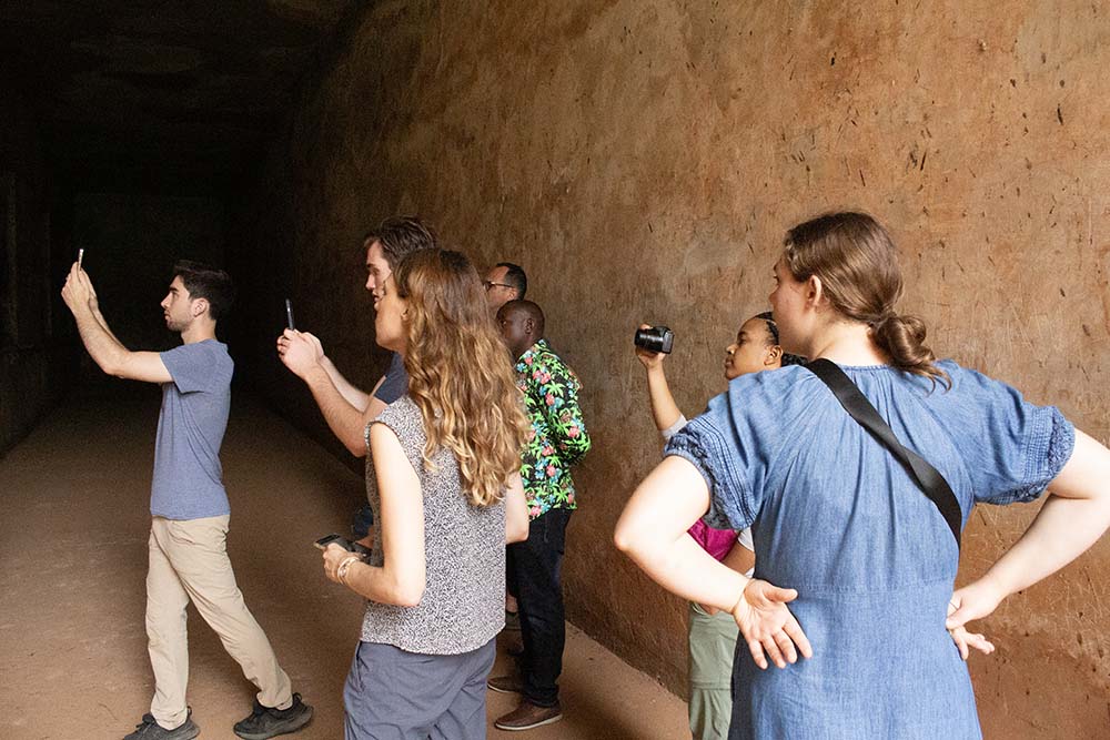 Touring the underground prison at Idi Amin Dada.