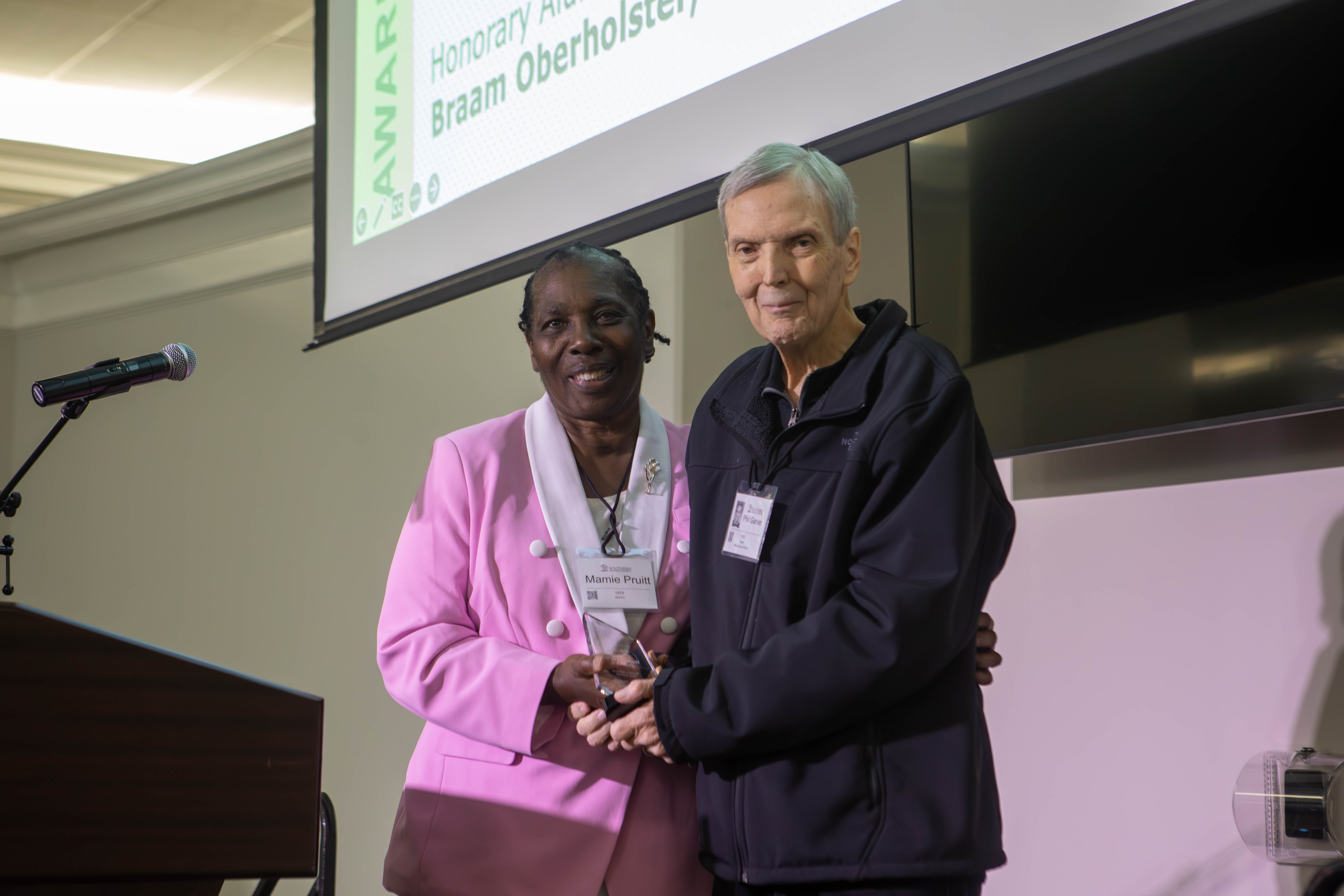 Mamie Pruitt receiving her alumni award on stage