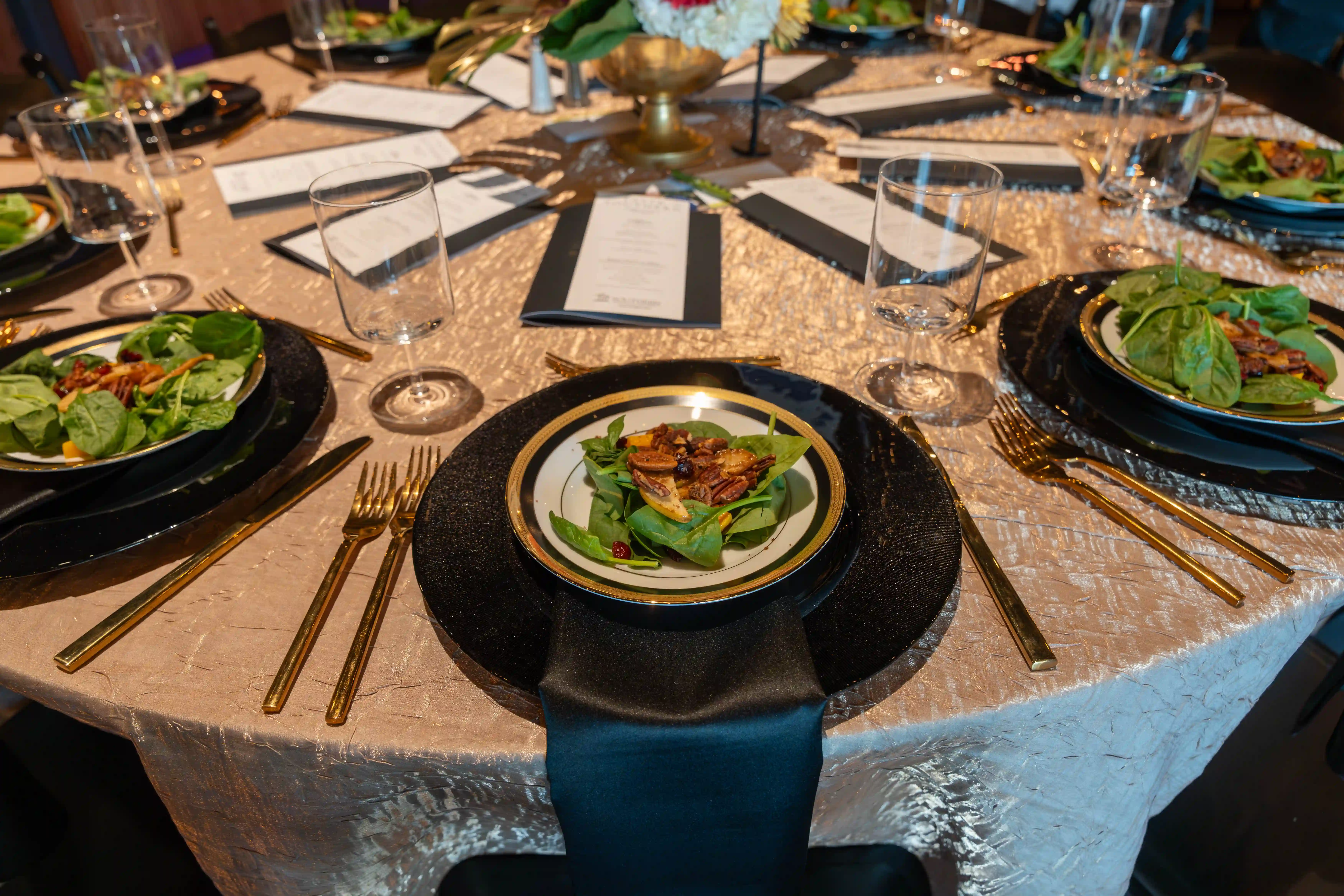 A single table place setting with a beautiful salad