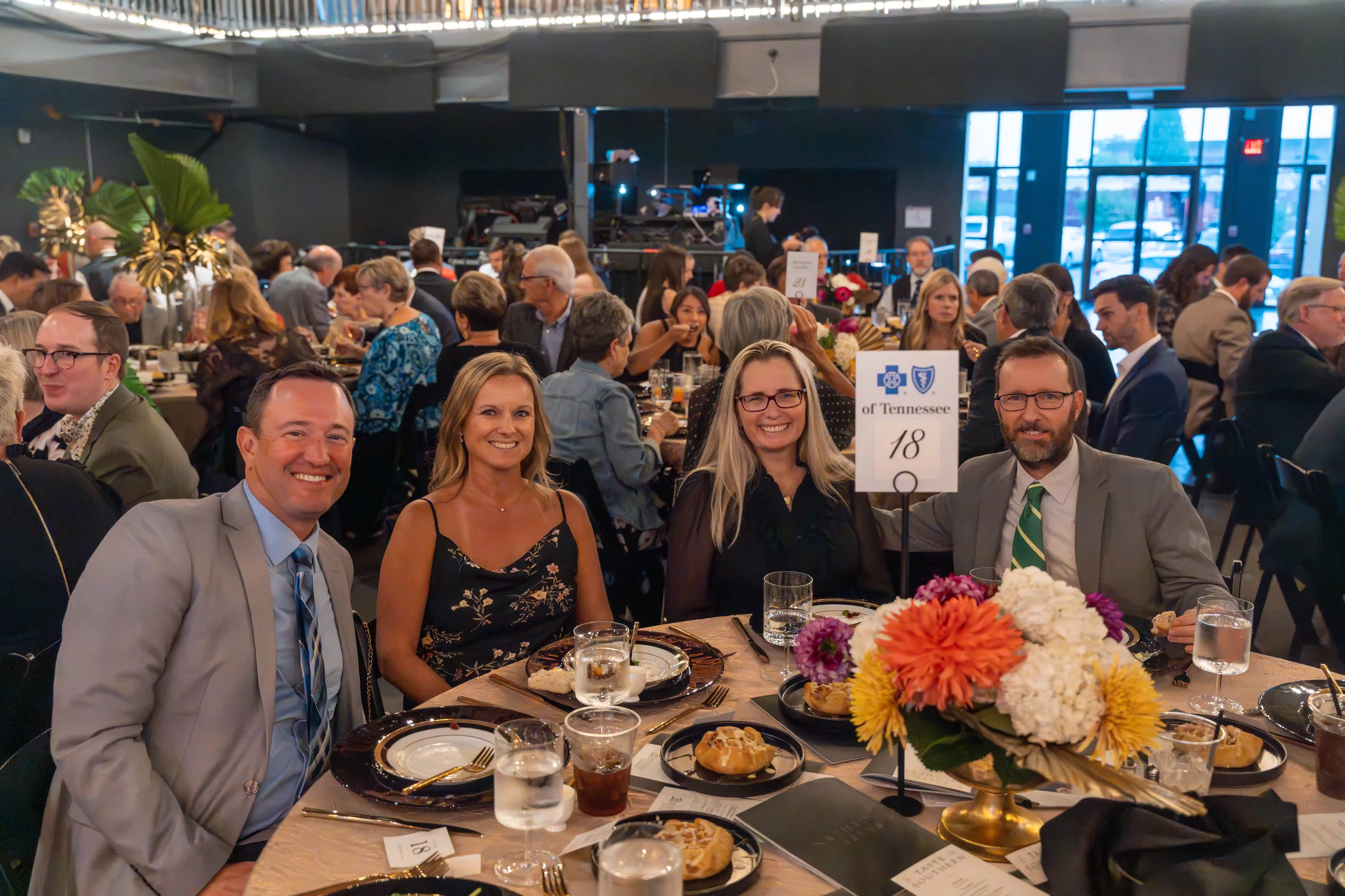 Jeff and Jenny Lemon seated at a table with Susie and Jack McClarty