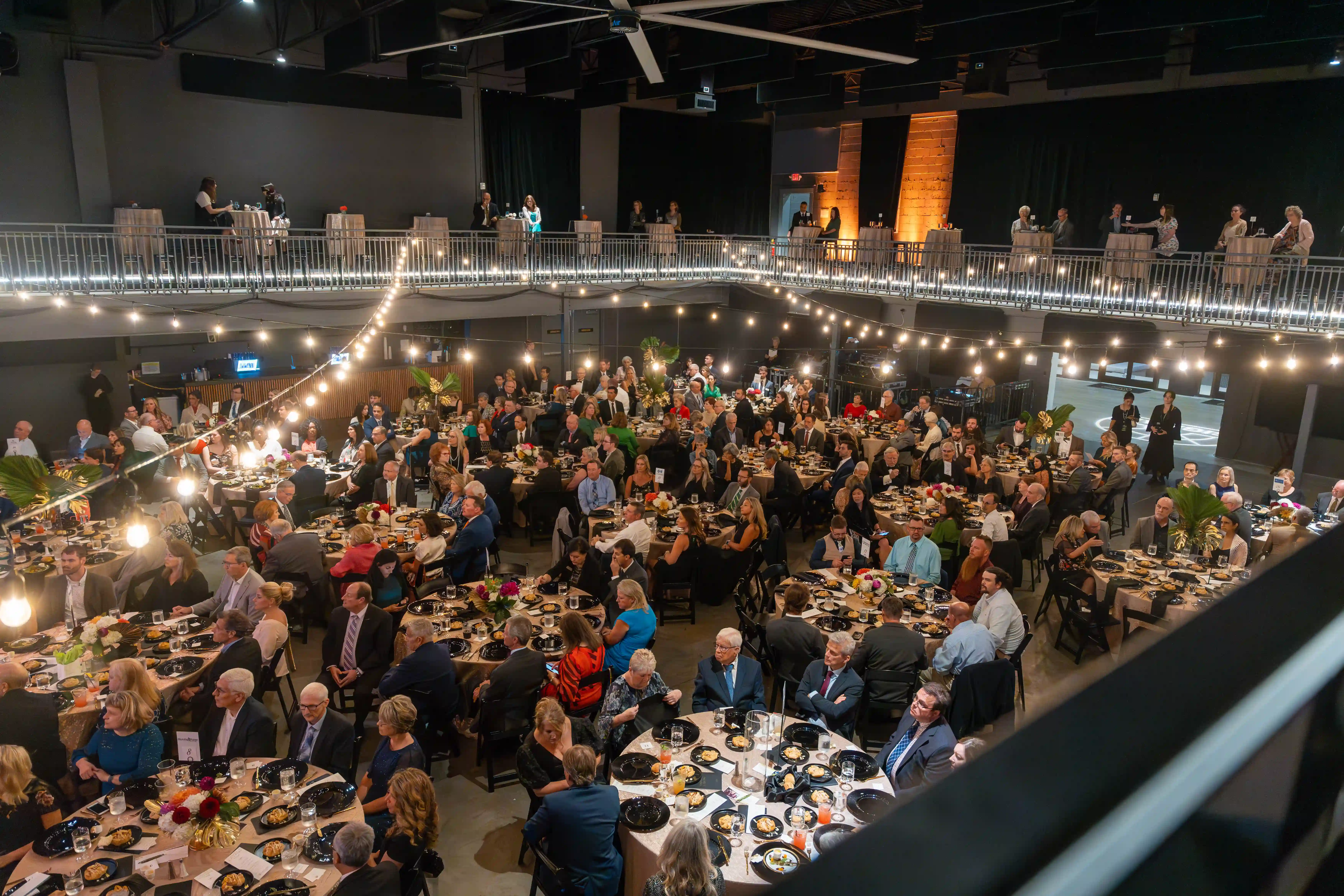 Overhead view of The Signal venue filled with guests at their tables