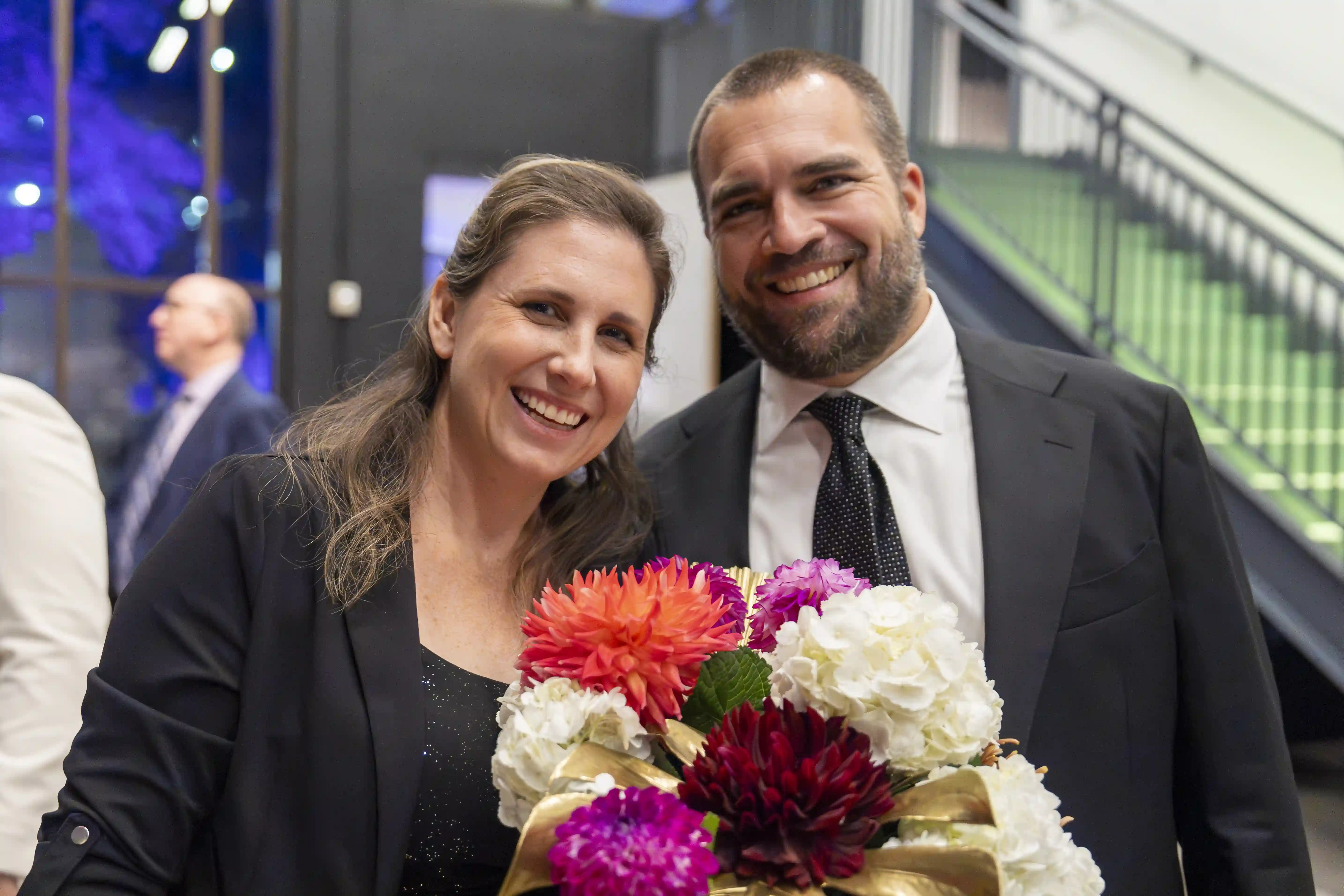 Rika Meyer and Aaron Meyer stand side-by-side posing for the picture.