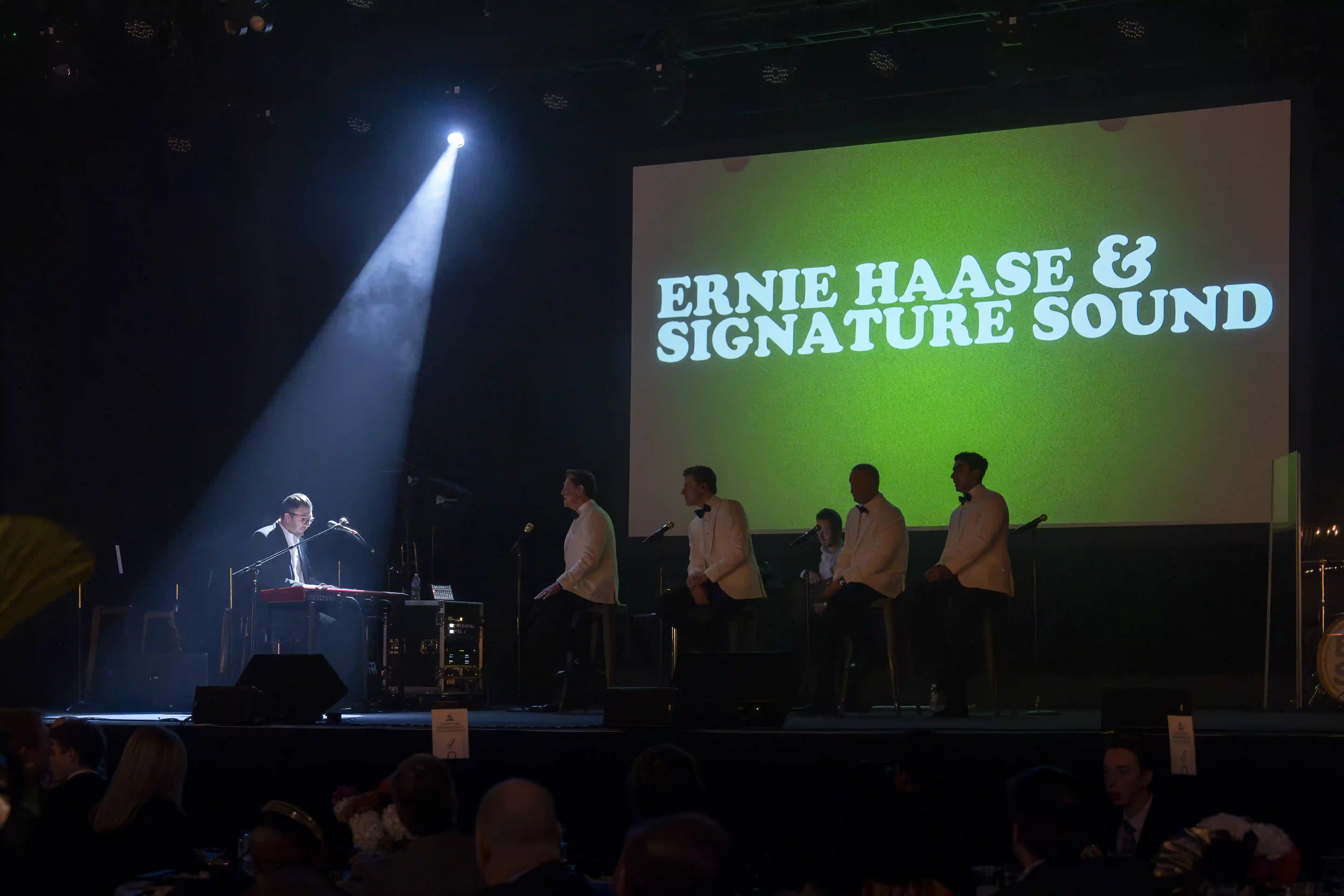 Pianist performing while Ernie Haase and Signature Sound sit on stage