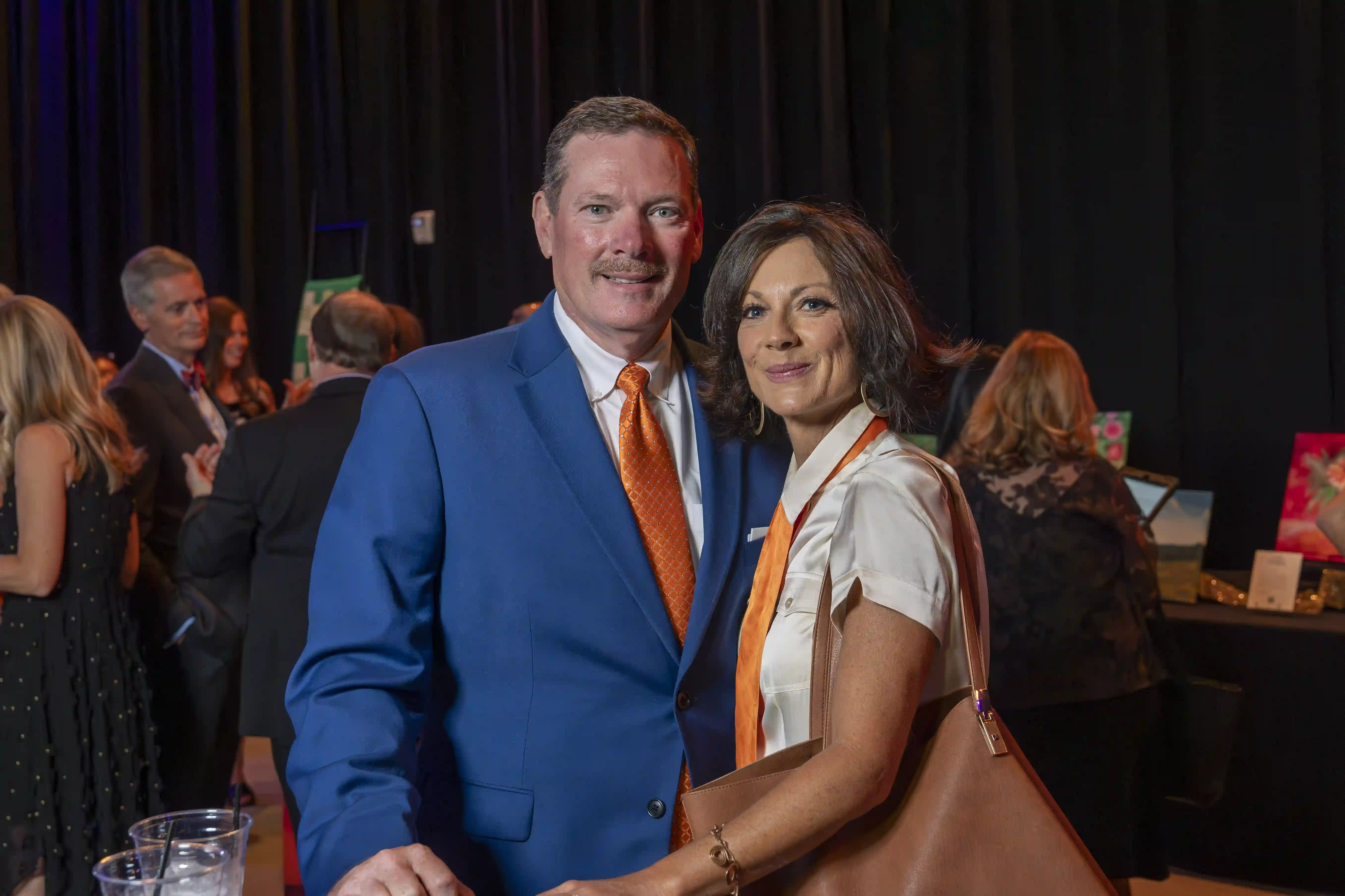 Jeff Eversole and Denise Eversole sanding side-by-side for the camera