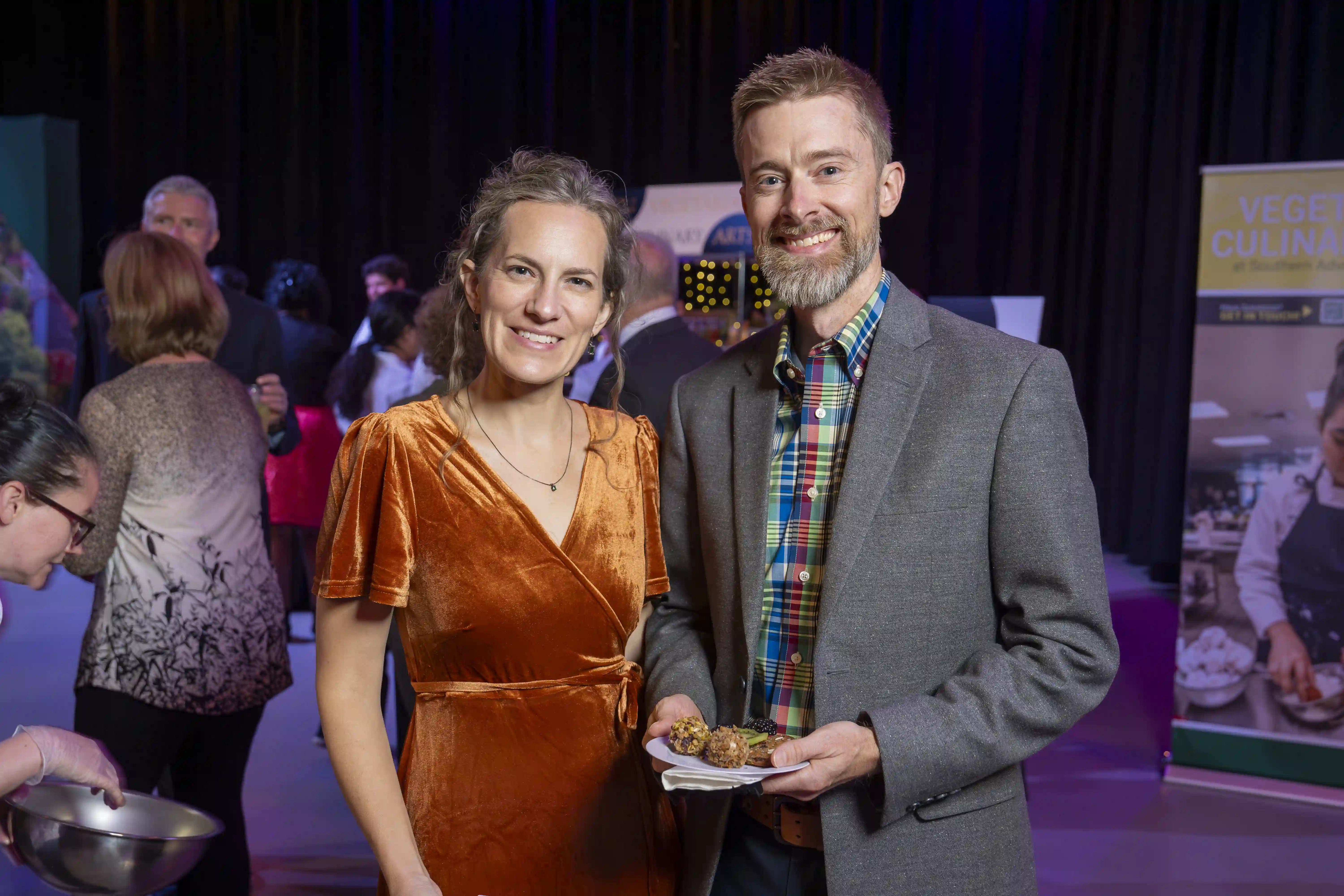 Rachel and Paul Beckmann standing next to each other for the camera