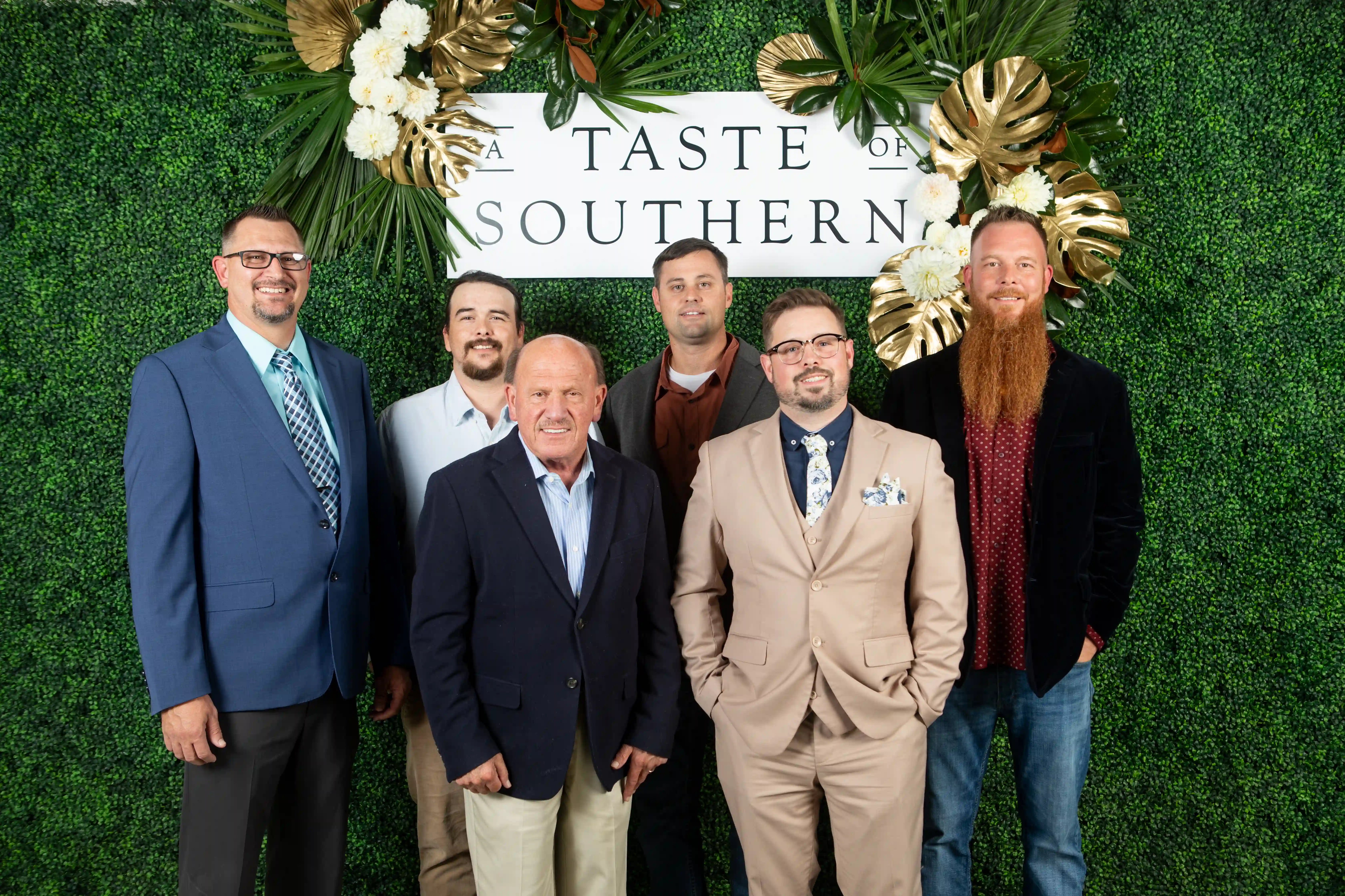 Jeremy Phifer, Ethan Dobbins, Don Johnson, Brad Traylor, Jerrod Johnson, and Zack Dobbins standing in front of a green backdrop