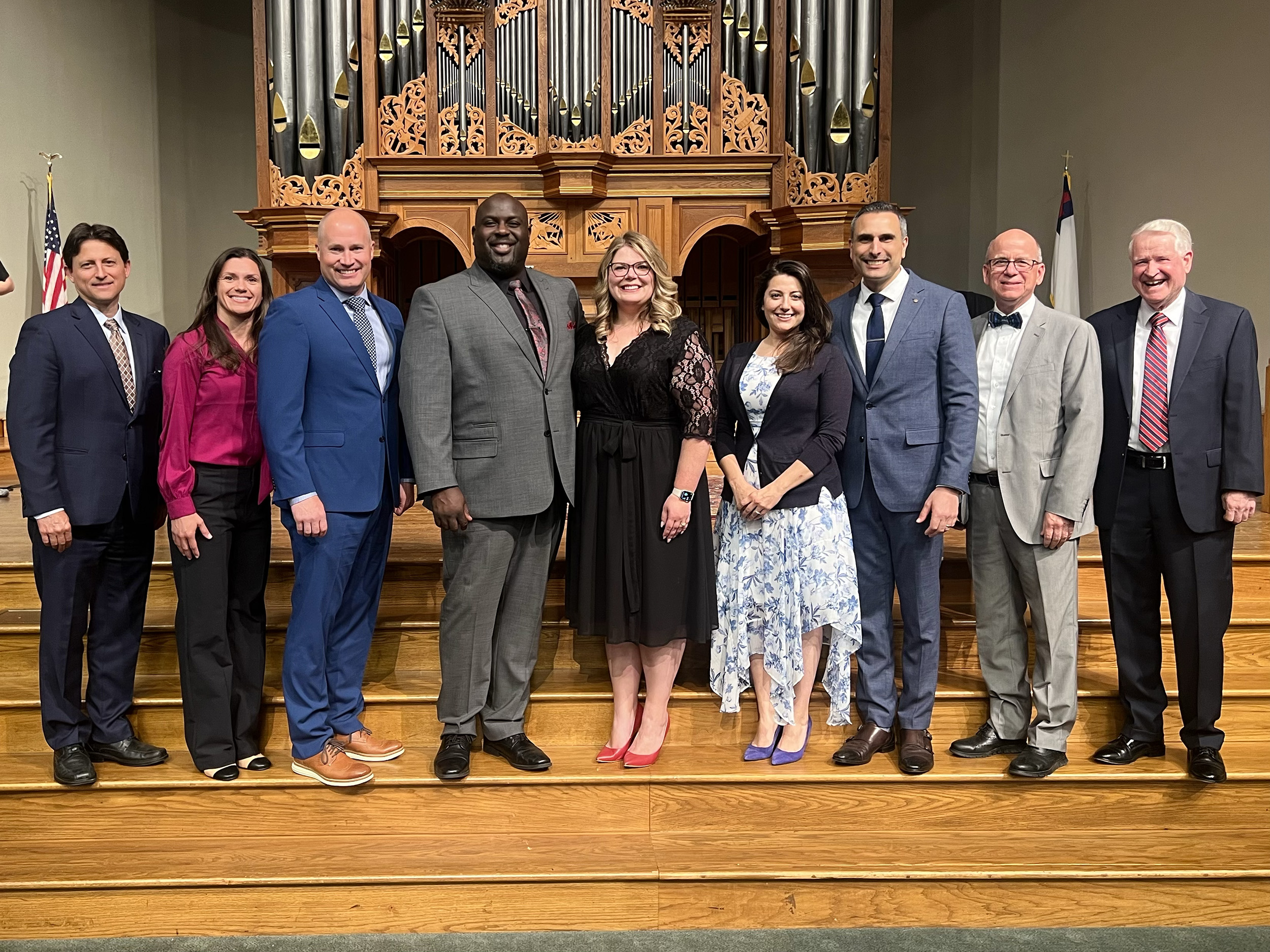 A group of university and union representatives with Bennett at the commissioning service.