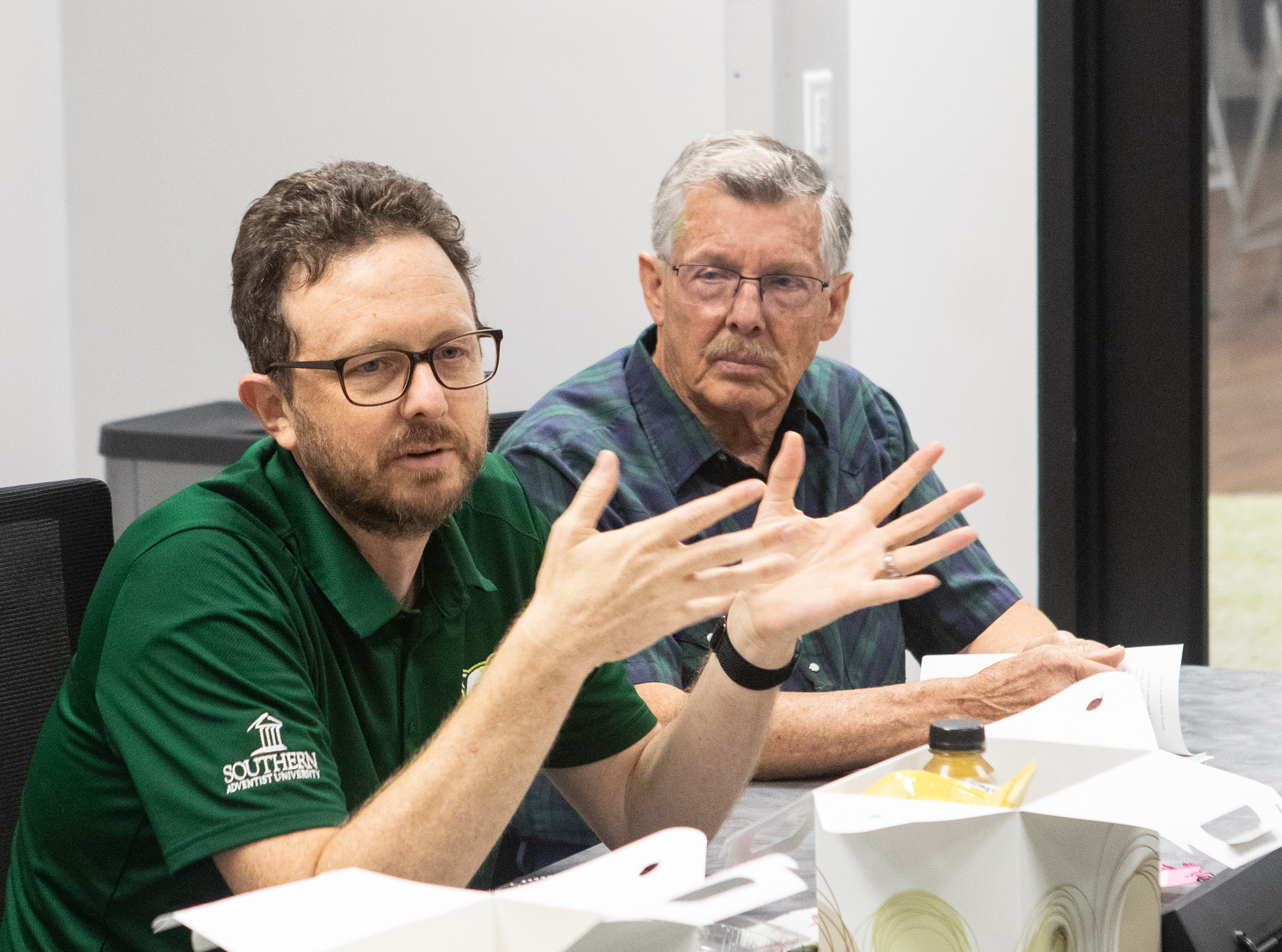 Aaron Corbit (left), PhD, biology professor, contributes to a Faith-Science Discussion during the Fall 2024 semester.