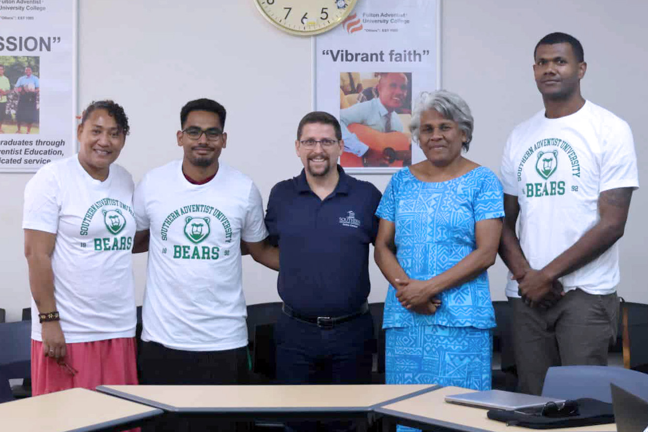 Several Fijian students currently enrolled in the program pose for a photo with Gus Martin and Nellie Manuca.